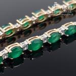 Auksinė apyrankė su žaliomis akutėmis