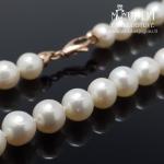 Auksinis perlų vėrinys