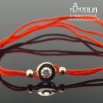 Auksinė apyrankė su balta akute