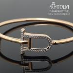 Auksinė apyrankė su baltomis akutėmis