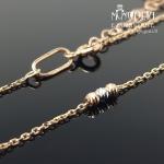 Auksinė grandinėlė ant kojos su burbuliukais