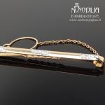 Auksinis kaklaraiščio segtukas