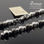 Sidabrinė grandinėlė ant kojos