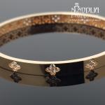 Auksinė apyrankė su akmenukais