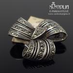 Sidabrinė sagė su akutėmis